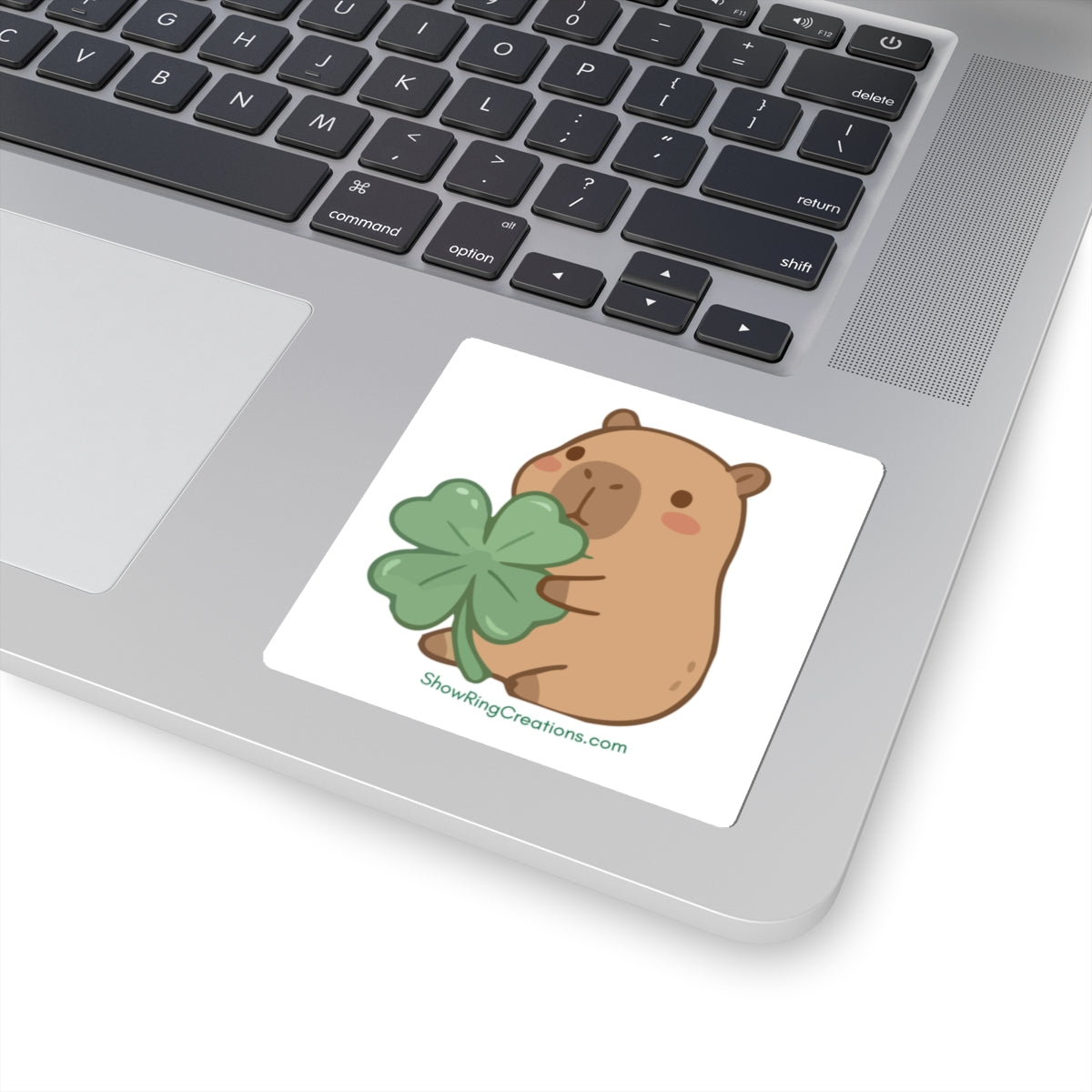 Cute Capybara Sticker — Kawaii Animal Holding 4-H-Like Four-Leaf Clover with ShowRingCreations.com Text Underneath